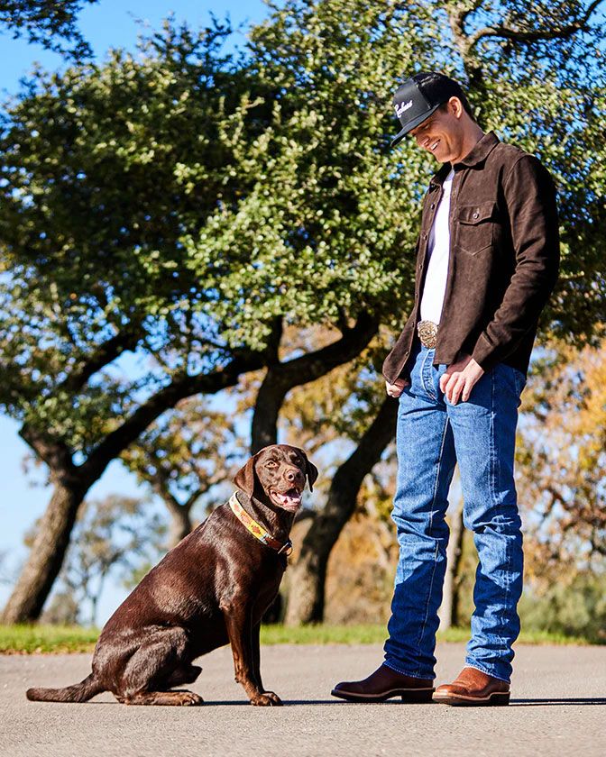 Parker McCollum and Ruger pose outside for a photo