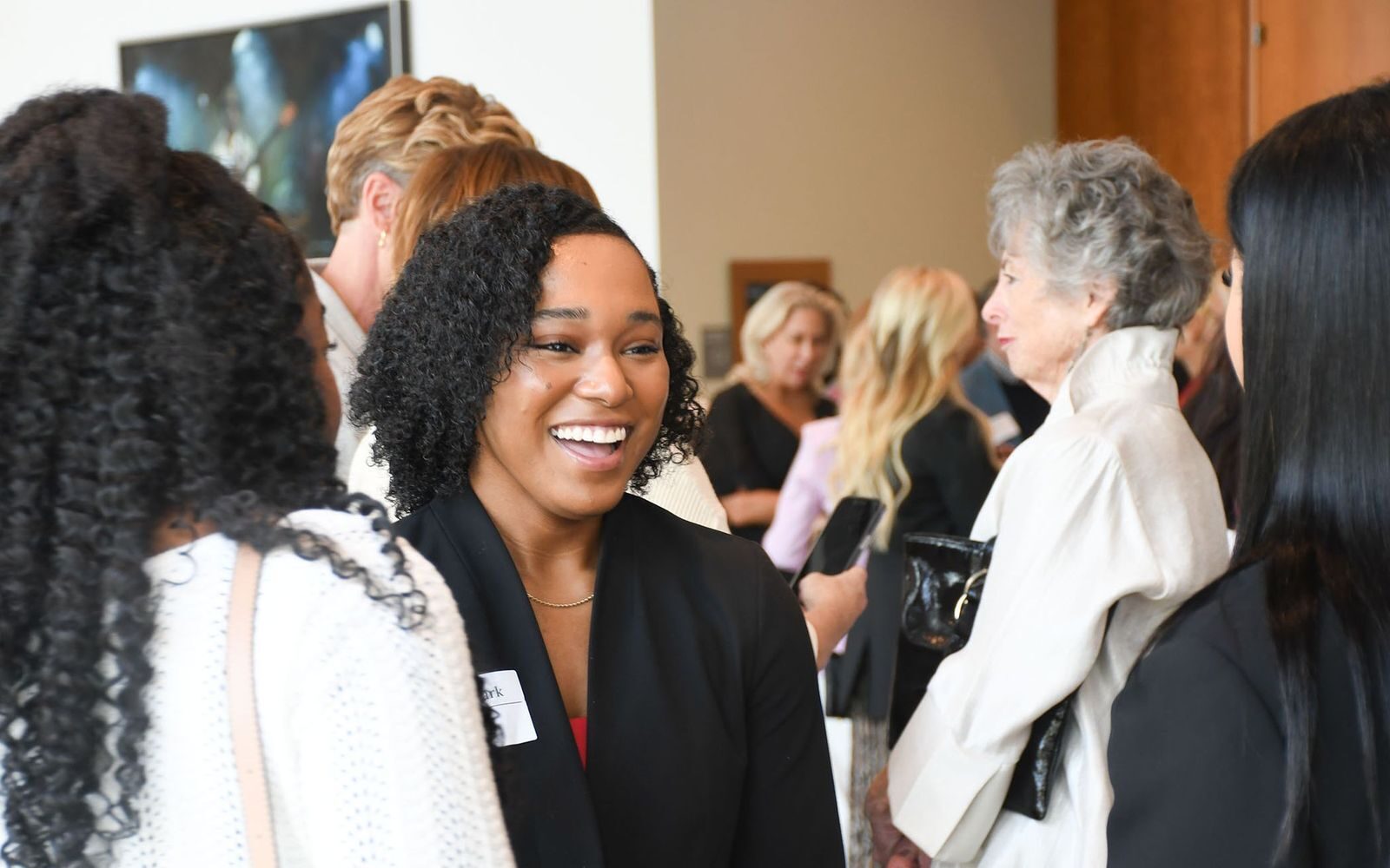 women talk at 2024 Power of the Purse event