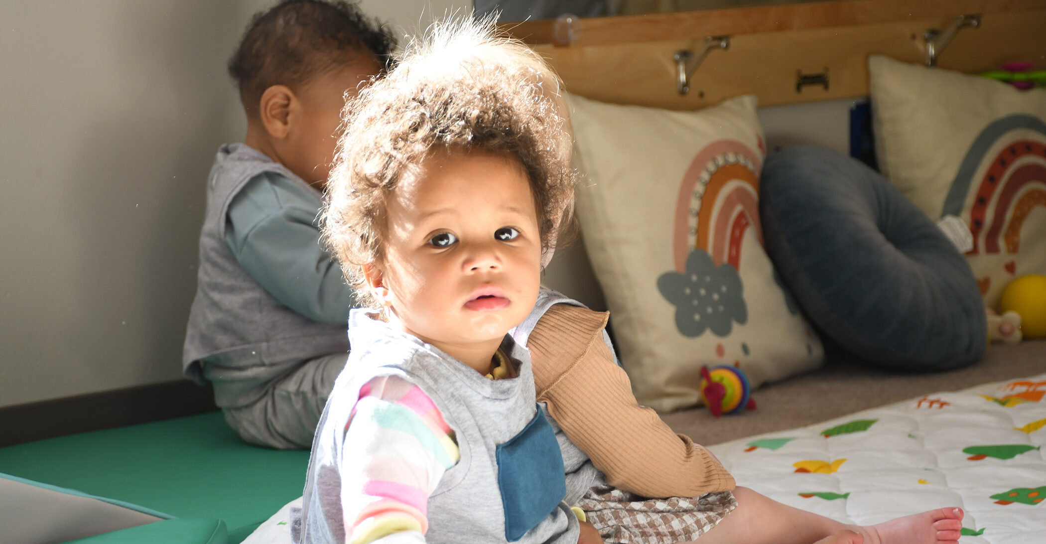toddler enjoys circle time at childcare center