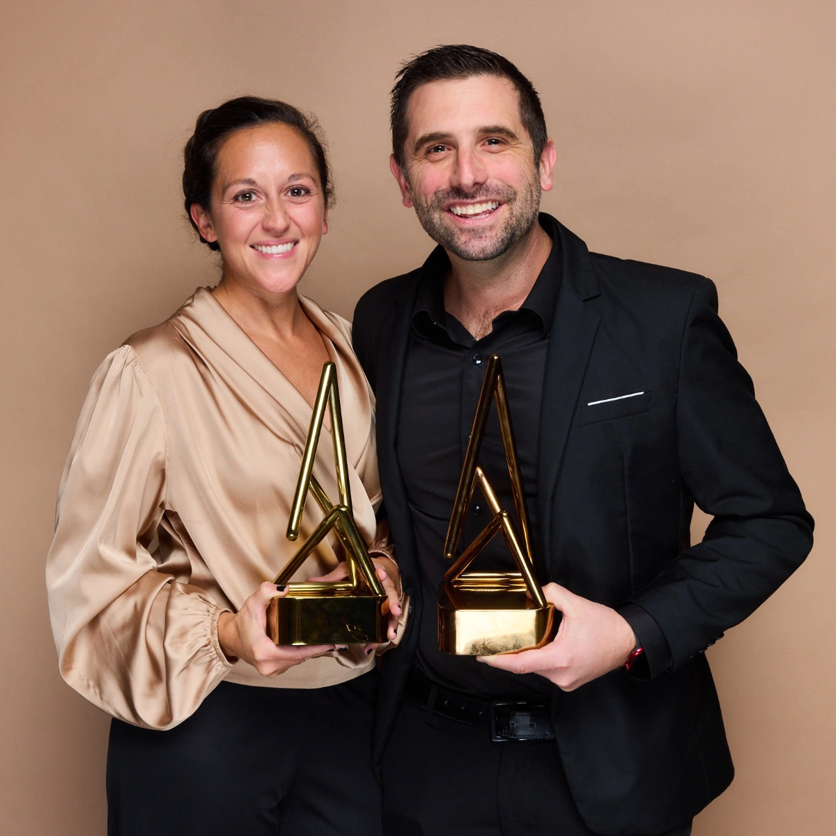 Jeremy and Kathleen Willet pose with an award