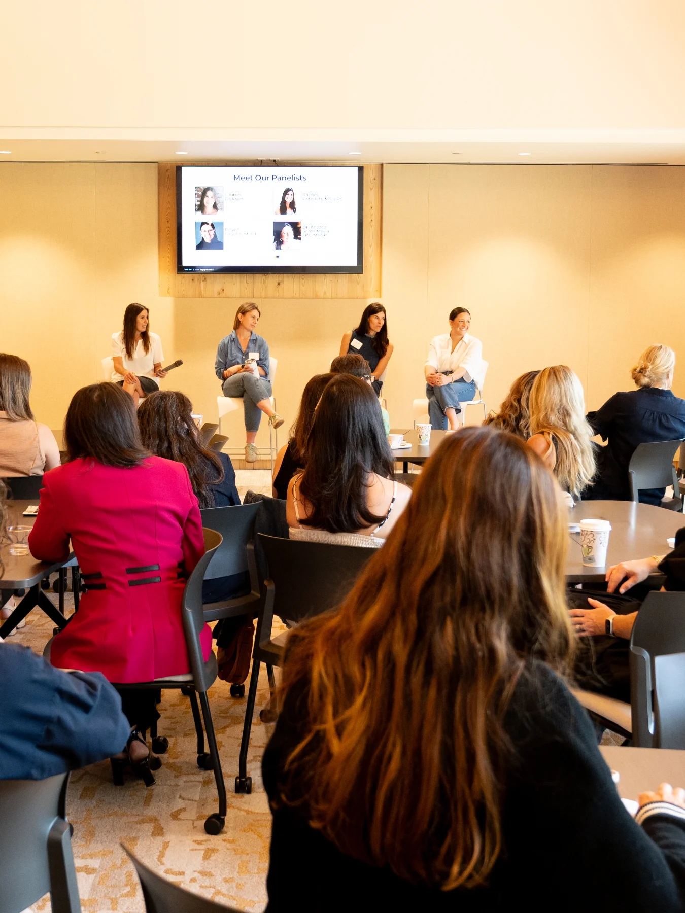 A group of women meet for a nonprofit focus panel in one of CFMT's community clubhouse spaces