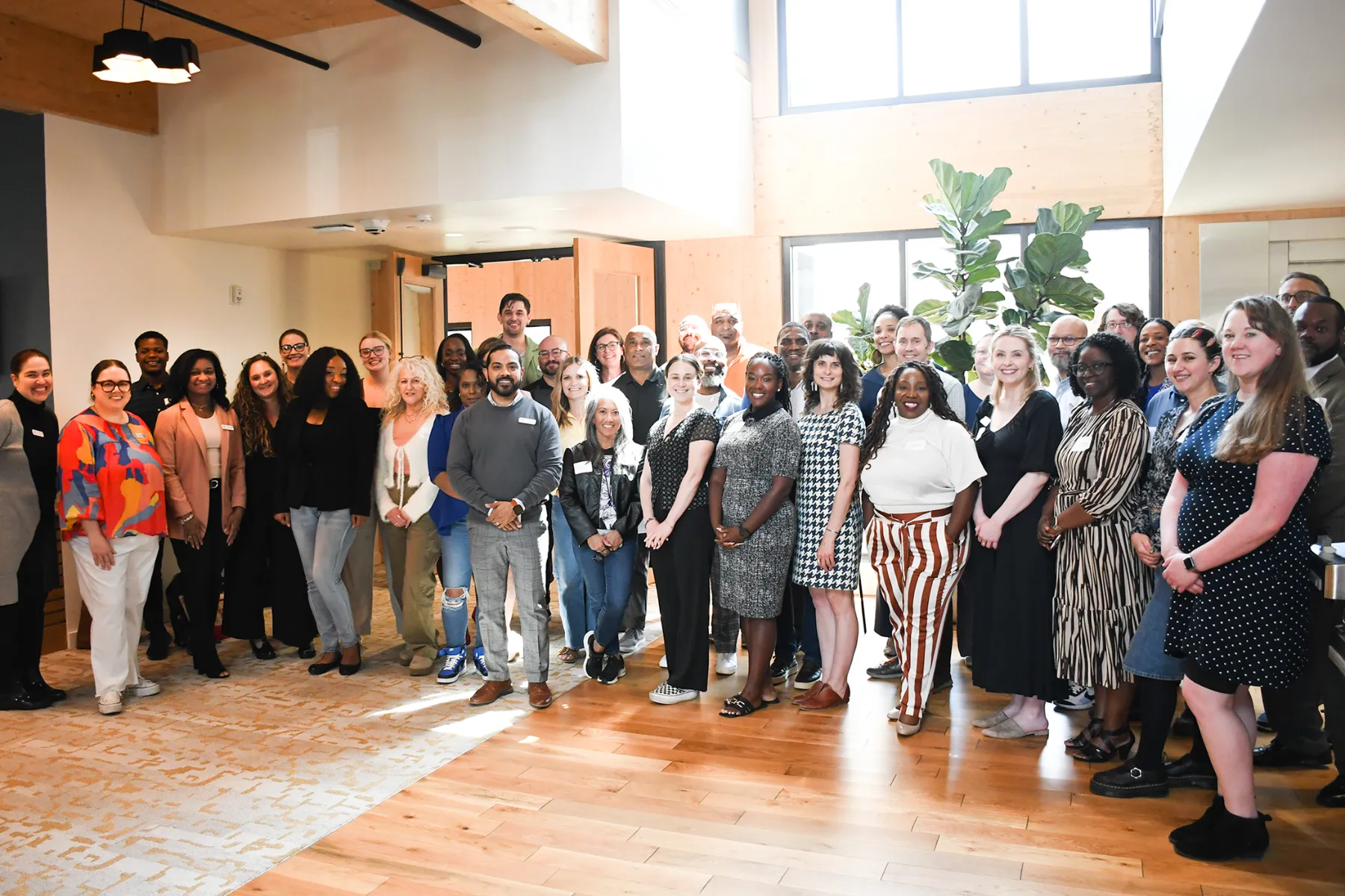 CFMT’s Community Impact team and community members gather for one of CFMT’s cohort sessions in the main lobby.