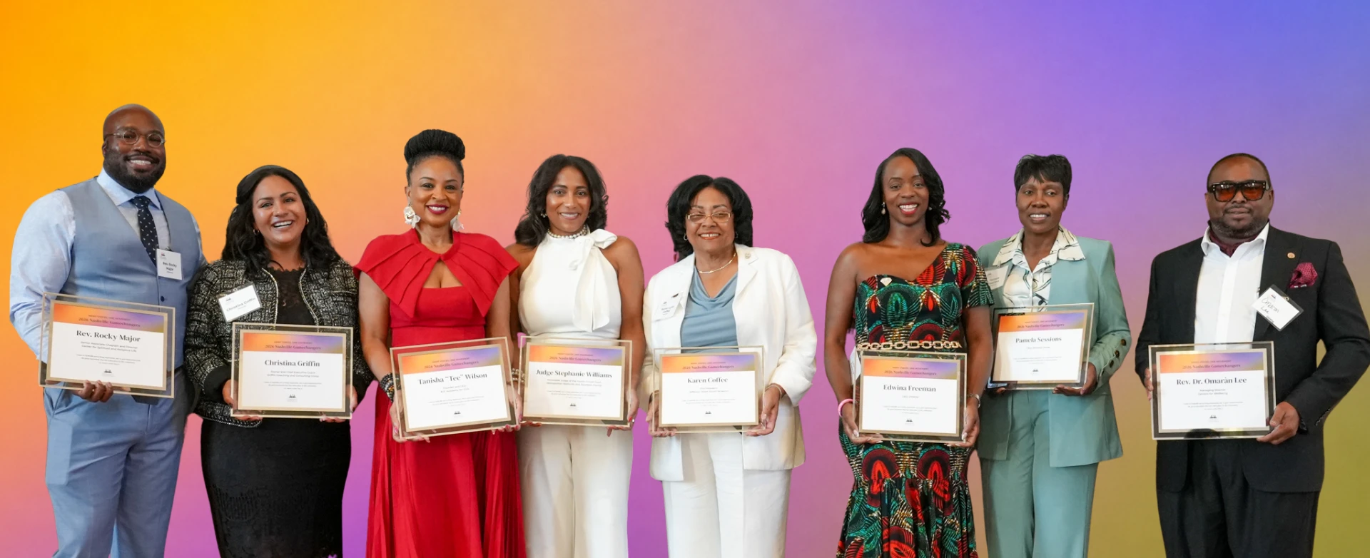 Nashville's 2026 Gamechangers show off their awards in front of a colorful gradient background.