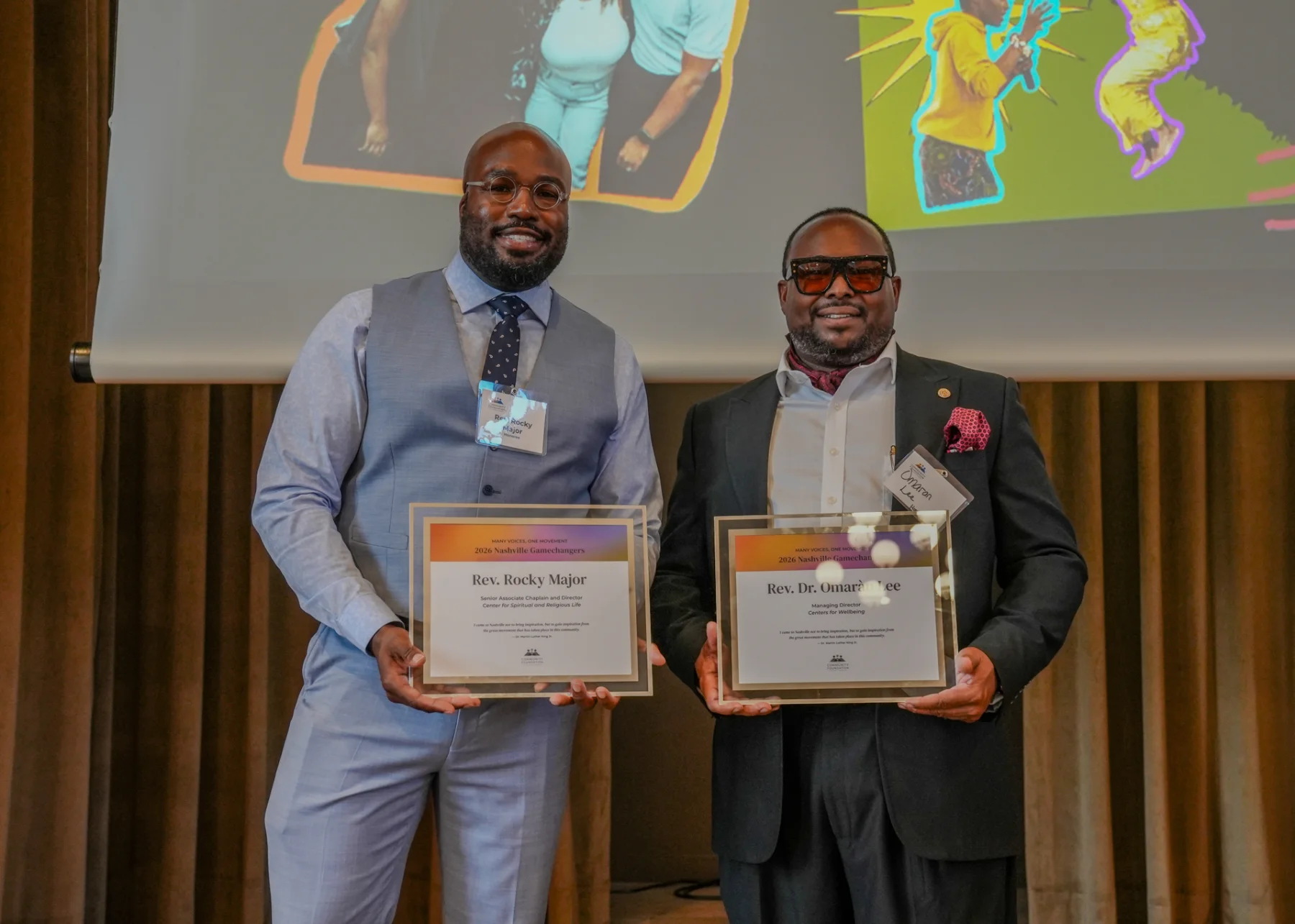 Rev. Rocky Major and Rev. Dr. Omaràn Lee display their Gamechanger awards onstage